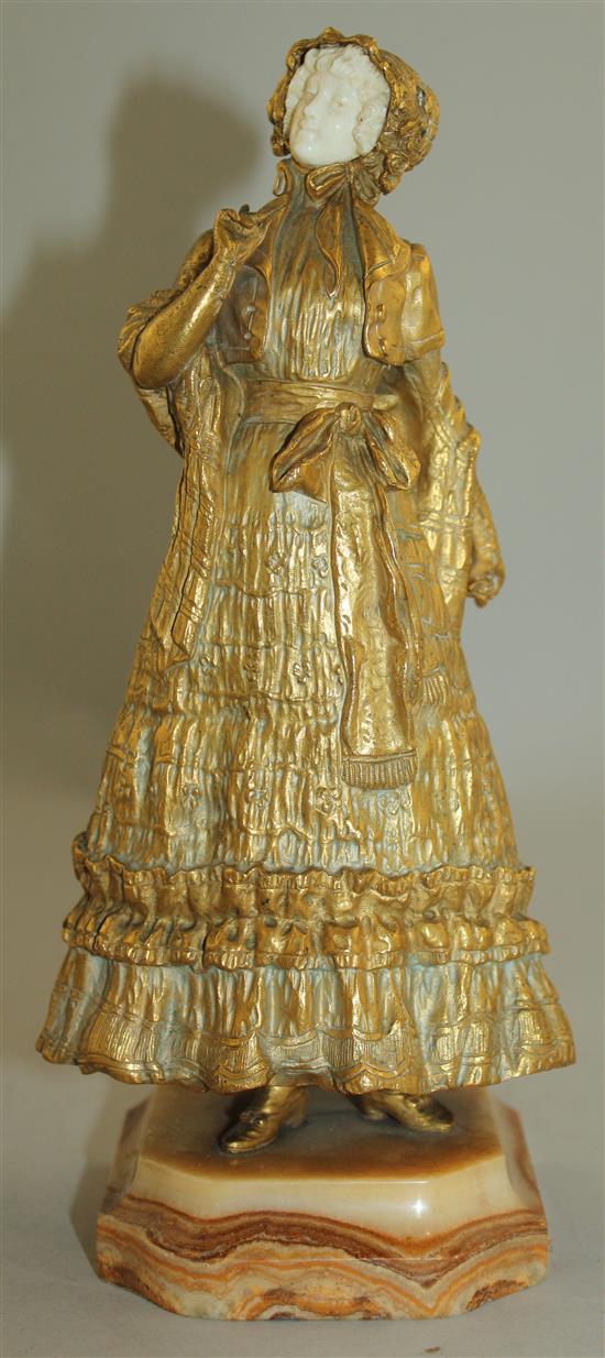 Rene Paul Marquet (French, 1879-1939). A gilt bronze and ivory figure of a lady wearing a bonnet, 10.25in.